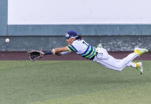 Everett AquaSox outfielder Tai Peete dives for a ball in the outfield during the game against the Spokane Indians on Wednesday, Aug. 20, 2025 in Everett, Washington. (Olivia Vanni / The Herald)