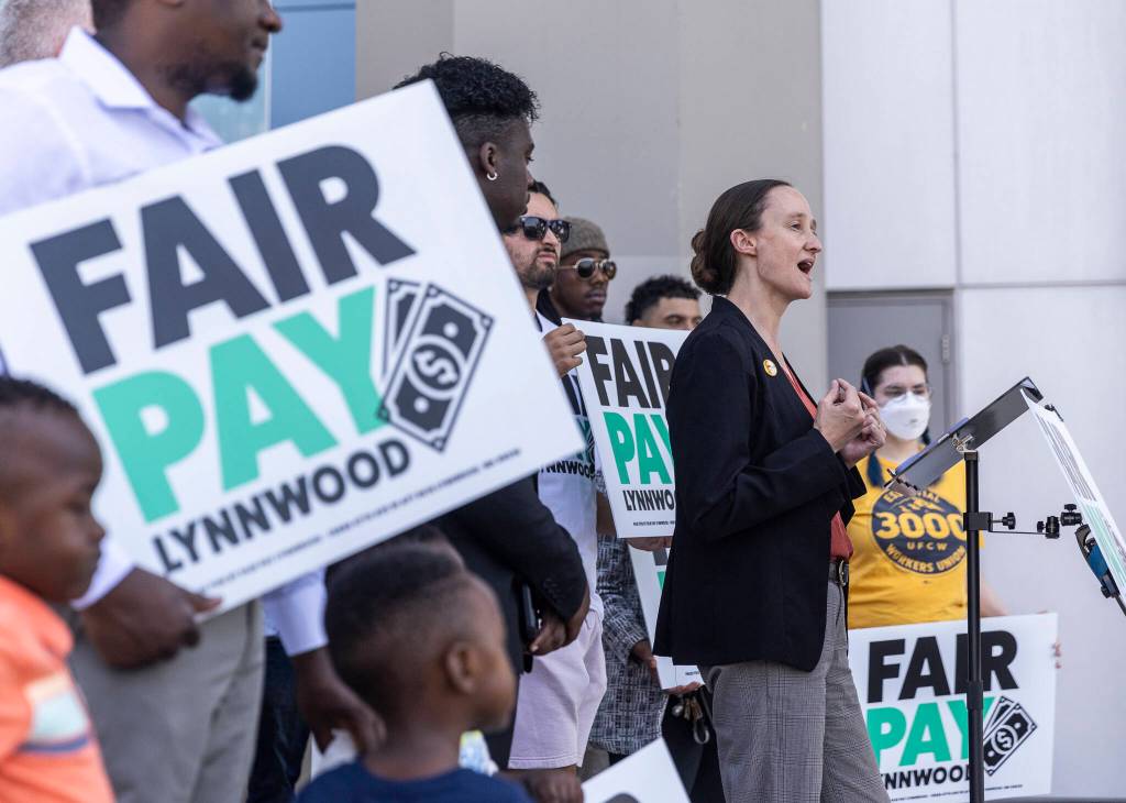 Executive Director of the Transit Riders Union Katie Wilson speaks at a Fair Pay Lynnwood rally at the Lynnwood Light Rail Station on Monday, Aug. 25, 2025 in Lynnwood, Washington. (Olivia Vanni / The Herald)