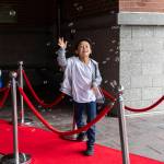 Ellis Adams, 8, jumps to try and pop bubbles as he makes his way inside for the first day of school at Monroe Elementary School on Wednesday, Aug. 27, 2025 in Everett, Washington. (Olivia Vanni / The Herald)