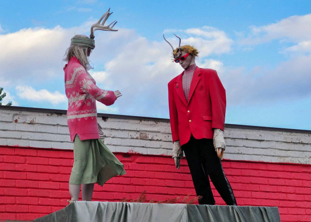 Two antler wearing mannequins pose on the roof of Thrifty Fox, a secondhand store in Twisp. (Sue Misao)