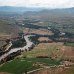 This 2007 aerial view of the Methow River is seen through the window of a small plane on a flight that originated from Twisp Municipal Airport. Looking north toward Twisp, about five miles up the road, the river is sandwiched between Highway 153 on the right and the Twisp-Carlton road on the left. (Sue Misao)