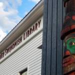 A story pole by Swinomish artist Kevin Paul and son-in-law Camas Logue welcomes visitors to the La Conner-Swinomish Library. (Jon Bauer / The Herald)