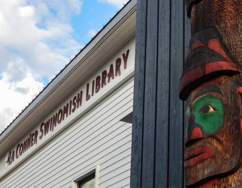 A story pole by Swinomish artist Kevin Paul and son-in-law Camas Logue welcomes visitors to the La Conner-Swinomish Library. (Jon Bauer / The Herald)
