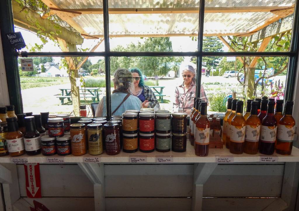 Hedlin Family Farms offers fresh produce, grown locally, and a range of locally made sauces, cheeses, meats, bread and more. (Jon Bauer / The Herald)
