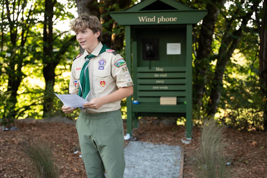 Michael Powers, 15, speaks while dedicating his wind phone project on Friday, Sept. 19 in Arlington, Washington. (Will Geschke / The Herald)