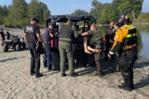 Washington Department of Fish and Wildlife officers arrest suspect after fishing him out of the Stillaguamish River on Wednesday, Sept. 4, 2025. (Washington Department of Fish and Wildlife)