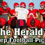 Stanwood's Michael Mascotti relays the next play to his teammates during football practice on Monday, Aug. 29, 2022 in Stanwood, Washington. (Olivia Vanni / The Herald)