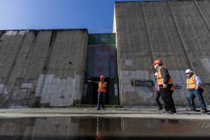 City of Everett Principal Engineer Zach Brown talks about where some of the piping will connect to the Port Gardner Storage Facility, an 8-million-gallon waste water storage facility, on Thursday, Feb. 27, 2025 in Everett, Washington. (Olivia Vanni / The Herald)