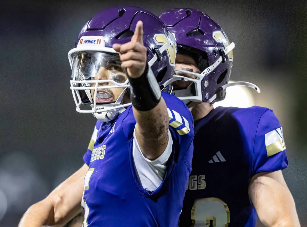 Lake Stevens Blake Moser points after getting enough yards for a first down during the game against Sumner on Friday, Sept. 5, 2025 in Lake Stevens, Washington. (Olivia Vanni / The Herald)