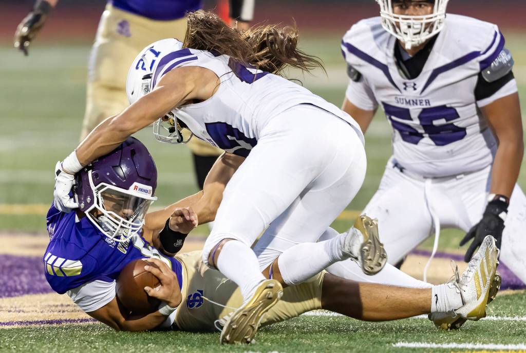 Lake Stevens Blake Moser is sacked during the game against Sumner on Friday, Sept. 5, 2025 in Lake Stevens, Washington. (Olivia Vanni / The Herald)