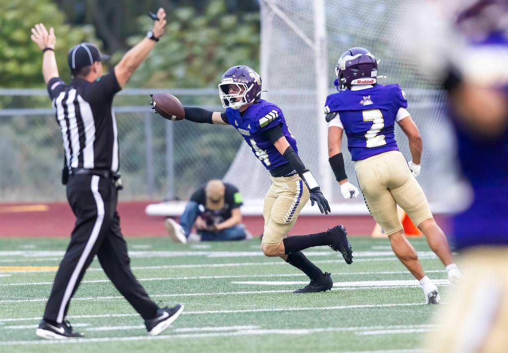 Lake Stevens Dylan Phinney celebrates getting a pick during the game against Sumner on Friday, Sept. 5, 2025 in Lake Stevens, Washington. (Olivia Vanni / The Herald)