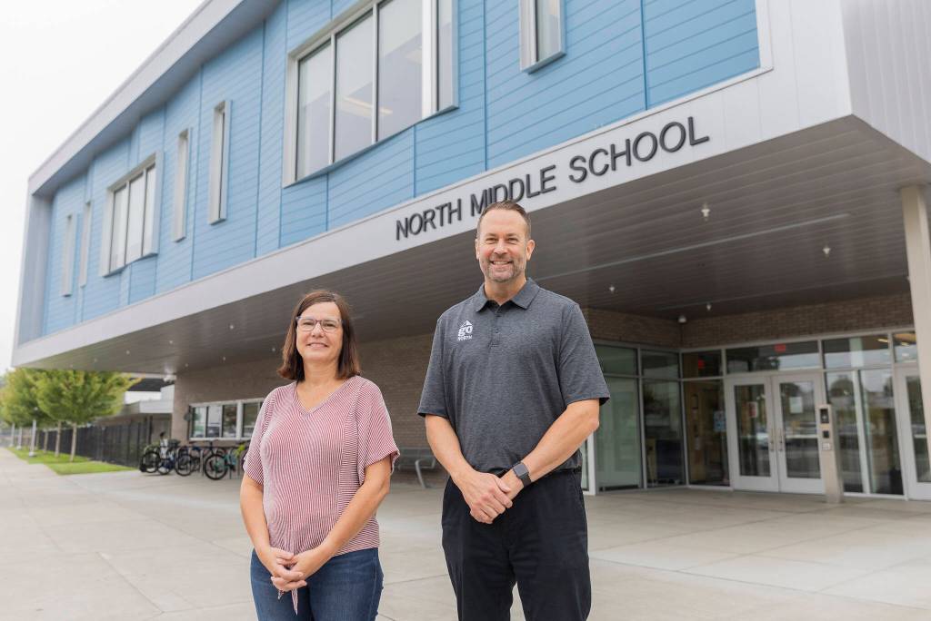 Teacher Jenny Overstreet and North Middle School Principal Tyler Ream outside of the school on Tuesday, Sept. 9, 2025 in Everett, Washington. (Olivia Vanni / The Herald)