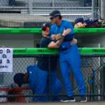 AquaSox outfielder Colin Davis embraces manager Zach Vincej from inside the dugout during Everetts 7-5 win against Eugene at Funko Field on Aug. 31, 2025 (Joe Pohoryles / The Herald)