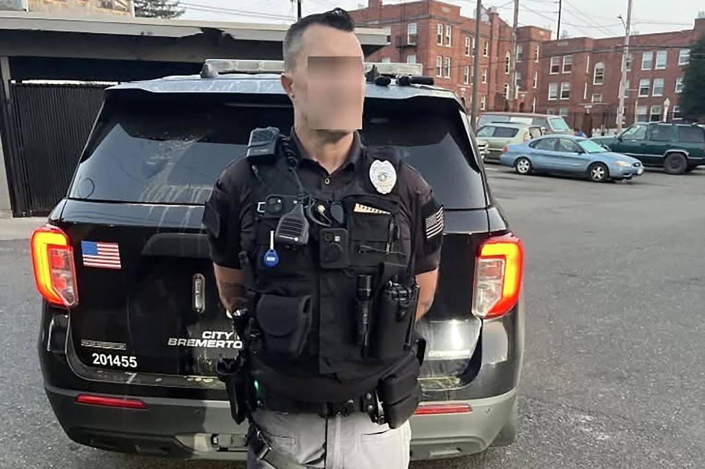 A man, with his face digitally blurred, was arrested by Bremerton police for allegedly impersonating an Edmonds police detective on Friday in Bremerton. (Bremerton Police Department)