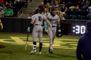 AquaSox outfielder Tai Peete (right) celebrates after hitting what was initially ruled a home run, but the play was overturned and ruled a foul ball during Everett's 4-2 loss to the Eugene Emeralds in Game 2 of the 2025 Northwest League Championship Series at PK Park on Wednesday. (Joe Pohoryles / The Herald)
