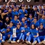 The Everett AquaSox pose in front of the outfield scoreboard with the championship trophy after beating the Eugene Emeralds 6-3 in Game 4 to clinch the 2025 Northwest League Championship at Funko Field on Sept. 13, 2025. (Joe Pohoryles / The Herald)