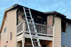 Firefighters responded Monday, Sep. 15, 2025, to reports of a woman trapped on the balcony of the Crystal Springs Apartments in Everett due to a fire on the west side of the building. (Everett Fire Department)