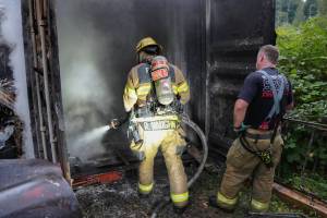 Firefighters responded to reports of a mobile home fire that spread to CONEX box and a pickup truck on Sunday, Sep. 14, 2025, in Monroe. The fire destroyed the contents of a nearby CONEX box. (Snohomish Regional Fire and Rescue)