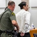 Alex Waggoner is handcuffed after being sentenced to 19 years for the murder of Abdulkadir Shariif on Wednesday, Sept. 17, 2025, in Everett, Washington. (Olivia Vanni / The Herald)