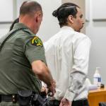 Alex Waggoner is handcuffed after being sentenced to 19 years for the murder of Abdulkadir Shariif Gedi on Wednesday, Sept. 17, 2025 in Everett, Washington. (Olivia Vanni / The Herald)