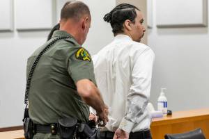 Alex Waggoner is handcuffed after being sentenced to 19 years for the murder of Abdulkadir Shariif Gedi on Wednesday, Sept. 17, 2025 in Everett, Washington. (Olivia Vanni / The Herald)
