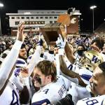 Washington Huskies football players celebrate after winning the Apple Cup at Martin Stadium in Pullman on Saturday, Nov. 26, 2022. (Photo courtesy of Washington Athletics)