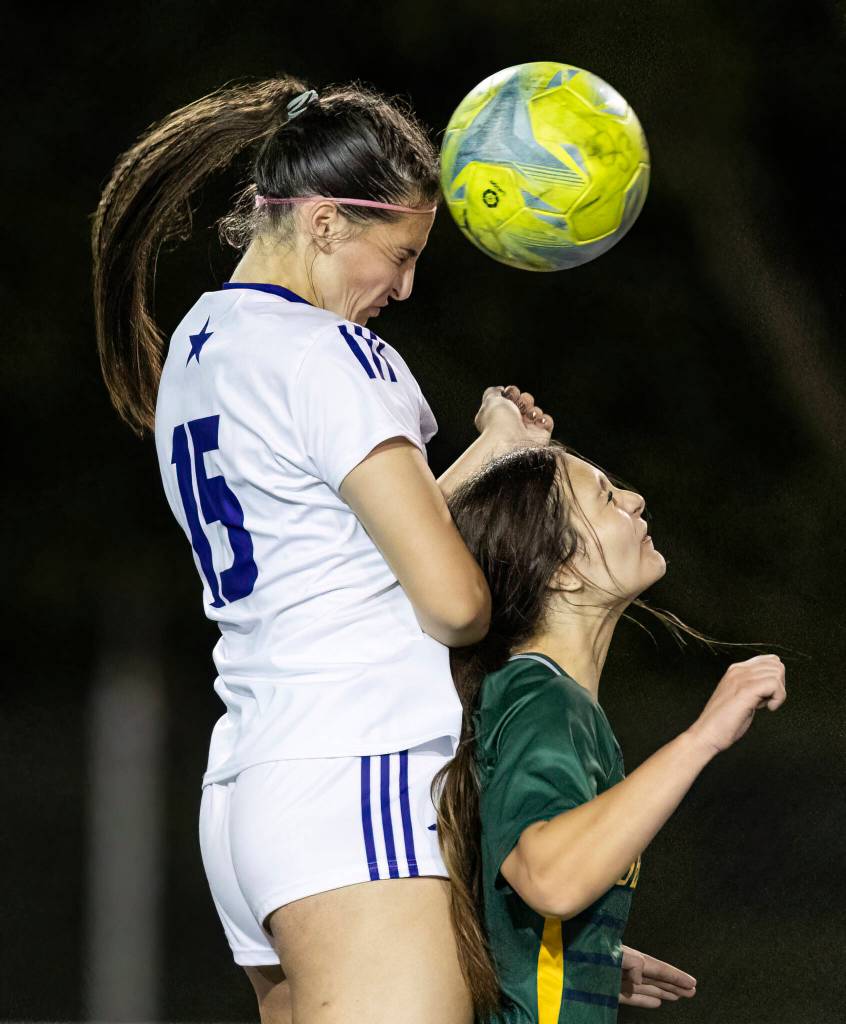 Lake Stevens Judith Roehl heads the ball during the game against Shorecrest on Thursday, Sept. 18, 2025 in Shoreline, Washington. (Olivia Vanni / The Herald)