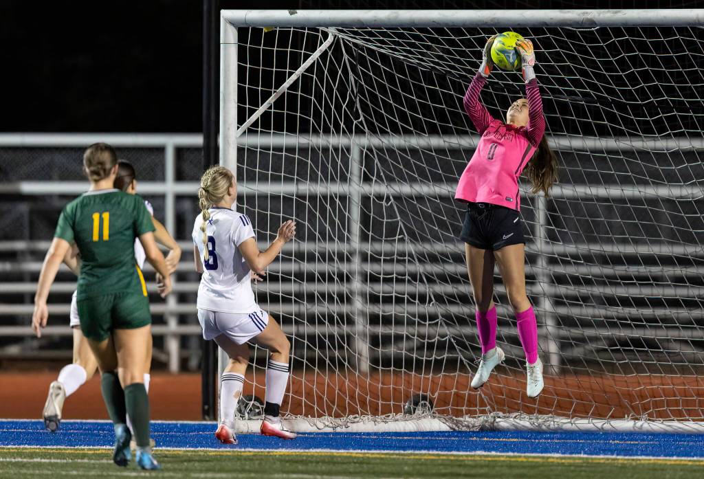 Shorecrests Mickie McNeil jumps in the air to make a save during the game against Lake Stevens on Thursday, Sept. 18, 2025 in Shoreline, Washington. (Olivia Vanni / The Herald)
