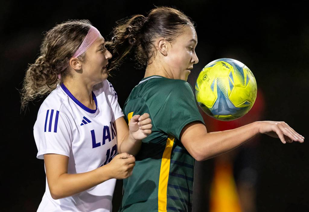 Shorecrests Olivia Taylor keeps the ball away from Lake Stevens Ava Pearson during the game on Thursday, Sept. 18, 2025 in Shoreline, Washington. (Olivia Vanni / The Herald)