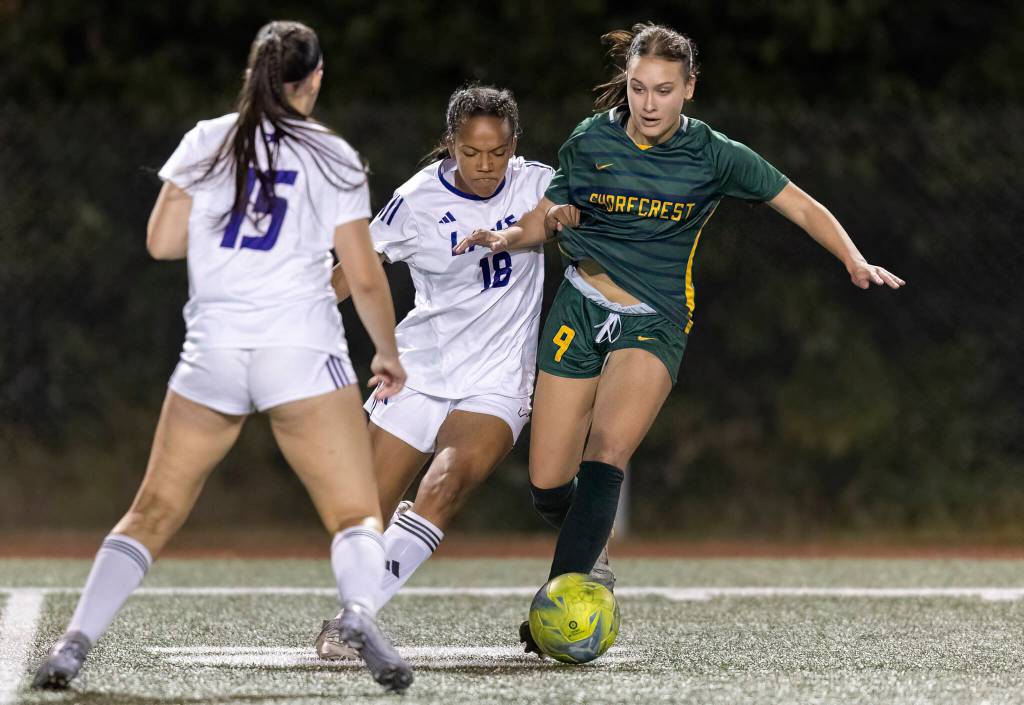 Lake Stevens Amayah Pennon grabs the jersey of Shorecrests Olivia Taylor while trying to get the ball during the game on Thursday, Sept. 18, 2025 in Shoreline, Washington. (Olivia Vanni / The Herald)