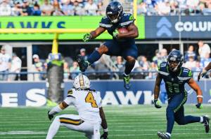 Seahawks running back Kenneth Walker II (9) tries to hurdle a New Orleans Saints cornerback Kool-Aid McKinstry (4) on Sunday, Sept. 21, 2025 at Lumen Field in Seattle, Washington. (Photo courtesy of the Seattle Seahawks)