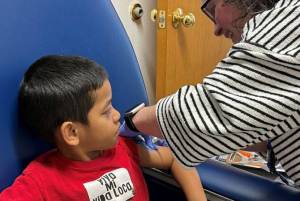 Rena Hone, 4, gets vaccinated at the Public Health Clinic on Sept. 22 by Medical Assistant Heather Rodriguez. (Provided photo)