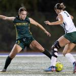 Shorecrests Olivia Taylor keeps the ball away from Edmonds-Woodways Magdalena Waters during the game on Sept. 23, 2025 in Shoreline, Washington. (Olivia Vanni / The Herald)