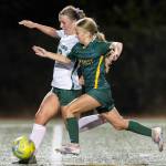 Edmonds-Woodways Abby Peterson and Shorecrests Cora Quinn run after the ball during the game on Sept. 23, 2025 in Shoreline, Washington. (Olivia Vanni / The Herald)