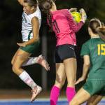 Edmonds-Woodways Jane Hanson jumps past Shorecrests Mickie McNeil while trying to head the ball during the game on Sept. 23, 2025 in Shoreline, Washington. (Olivia Vanni / The Herald)