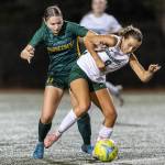 Shorecrest’s Emma Lund and Edmonds-Woodway’s Jane Hanson fight for possession during the game on Sept. 23, 2025 in Shoreline, Washington. (Olivia Vanni / The Herald)