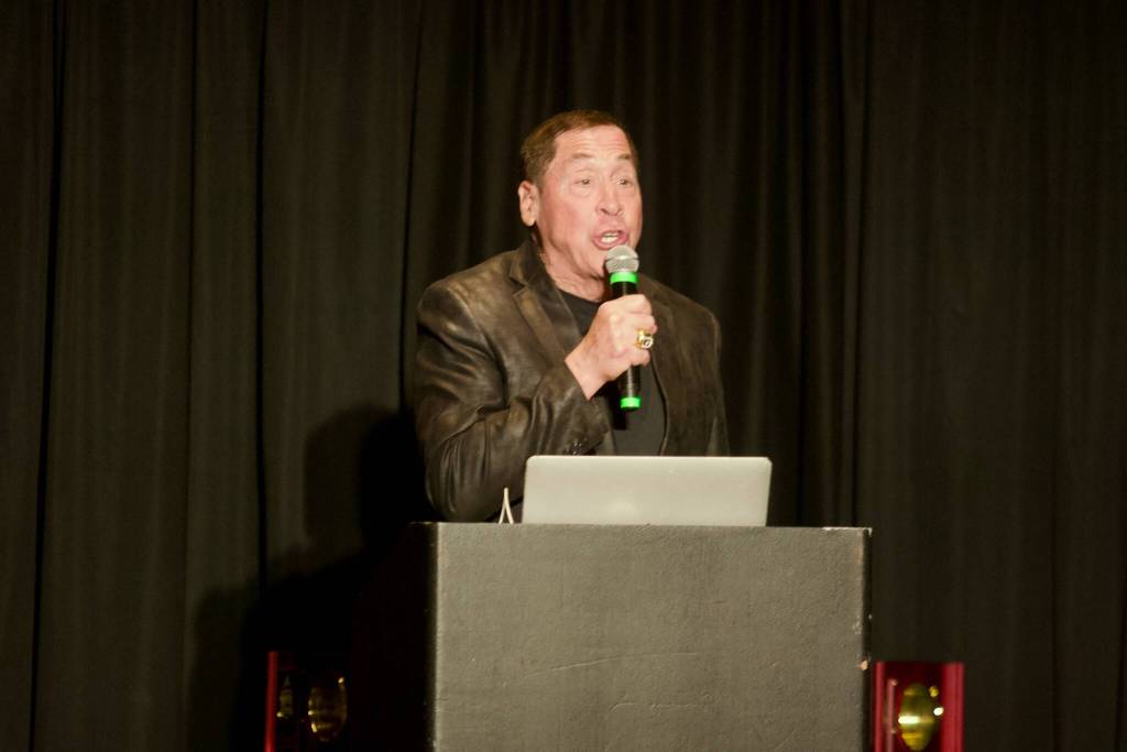 Roy Firestone delivers his keynote presentation during the Snohomish County Sports Hall of Fame Banquet at the Edward D. Hansen Conference Center in Everett on Sept. 24, 2025. (Joe Pohoryles / The Herald)