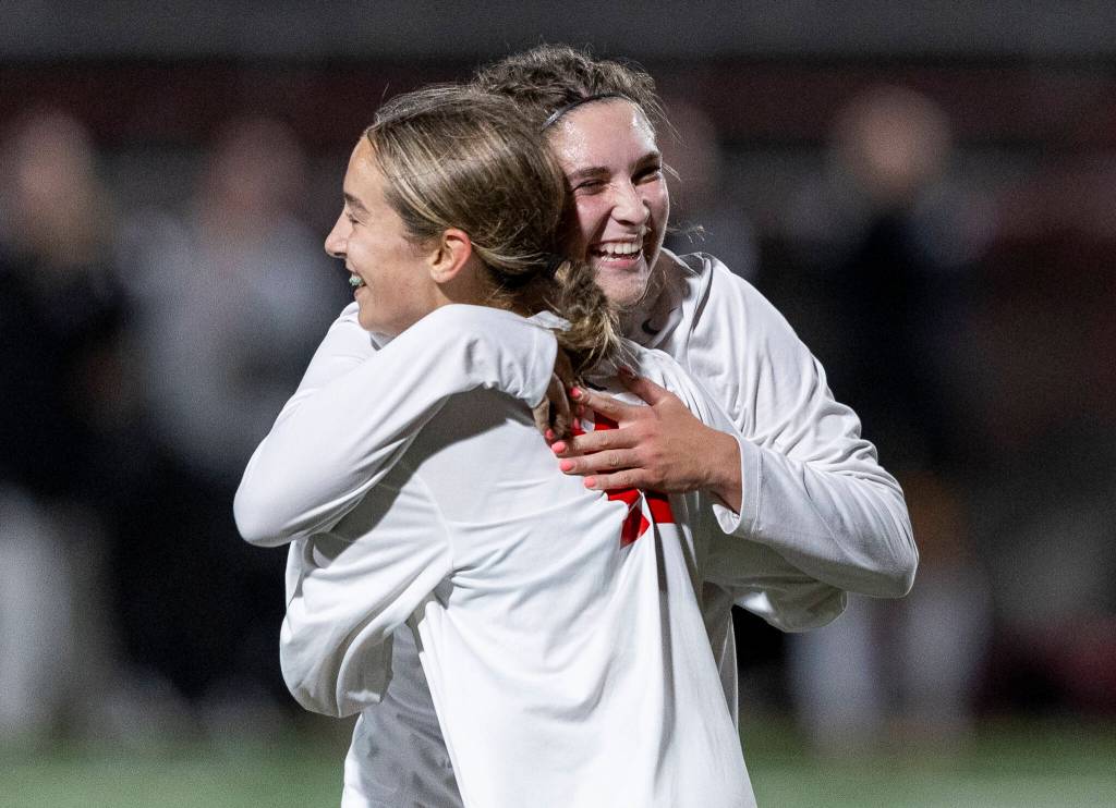 Snohomishs Danica Avalos hugs her teammate on Sept. 25, 2025 in Stanwood, Washington. (Olivia Vanni / The Herald)