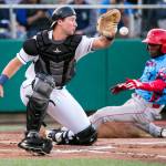 Kevin Clark / The Herald file photo
Spokane Indians J.P. Martinez beats the throw to AquaSoxs Cal Raleigh for a run at Everett Memorial Stadium in Everett on Sept. 5, 2018. Raleigh, who played for Everett during the 2018 season, leads the MLB with 60 home runs this season, a record for catchers.