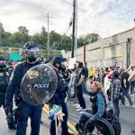 About 200 people showed up to protest outside the Immigration and Customs Enforcement building in Portland on Sunday, Sept. 28. (Photo by Alex Baumhardt/Oregon Capital Chronicle)