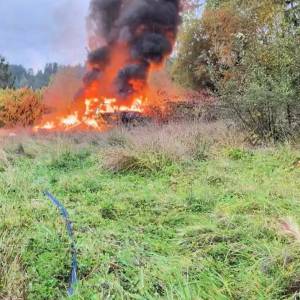 Firefighters responded to a report of a fire at an abandoned structure and neighboring vehicle near the Bothell Everett Highway and 173rd Street Southeast. (South County Fire)