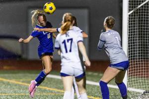 Lake Stevens’ Shelby Clifton heads the ball off a cross into the goal to score during the game against Kamiak on Sept. 30, 2025 in Lake Stevens, Washington. (Olivia Vanni / The Herald)