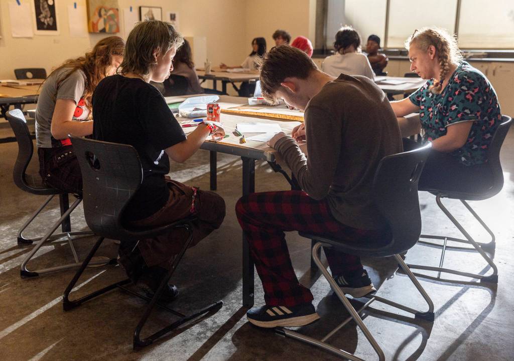 People gathered for Teen Night at the Schack Art Center work on lettering on Sept. 18, 2025 in Everett, Washington. (Olivia Vanni / The Herald)