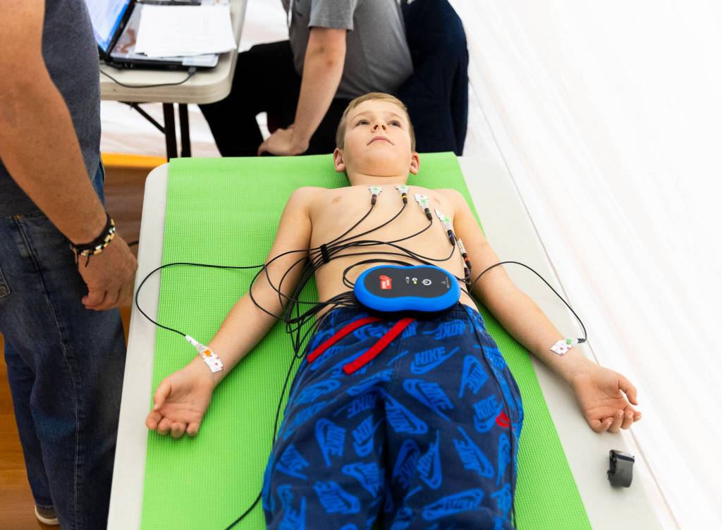 Jack Peto waits while an EKG machine records his hearts electrical activity during Stanwood High Schools EKG Youth Heart Screening event on Oct. 1, 2025 in Stanwood, Washington. (Olivia Vanni / The Herald)