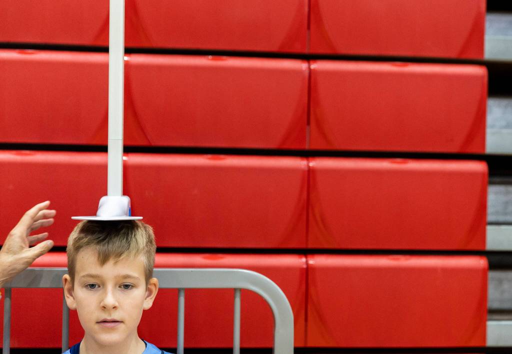 Jack Peto has his height recorded before getting hooked up to an EKG on Oct. 1, 2025 in Stanwood, Washington. (Olivia Vanni / The Herald)