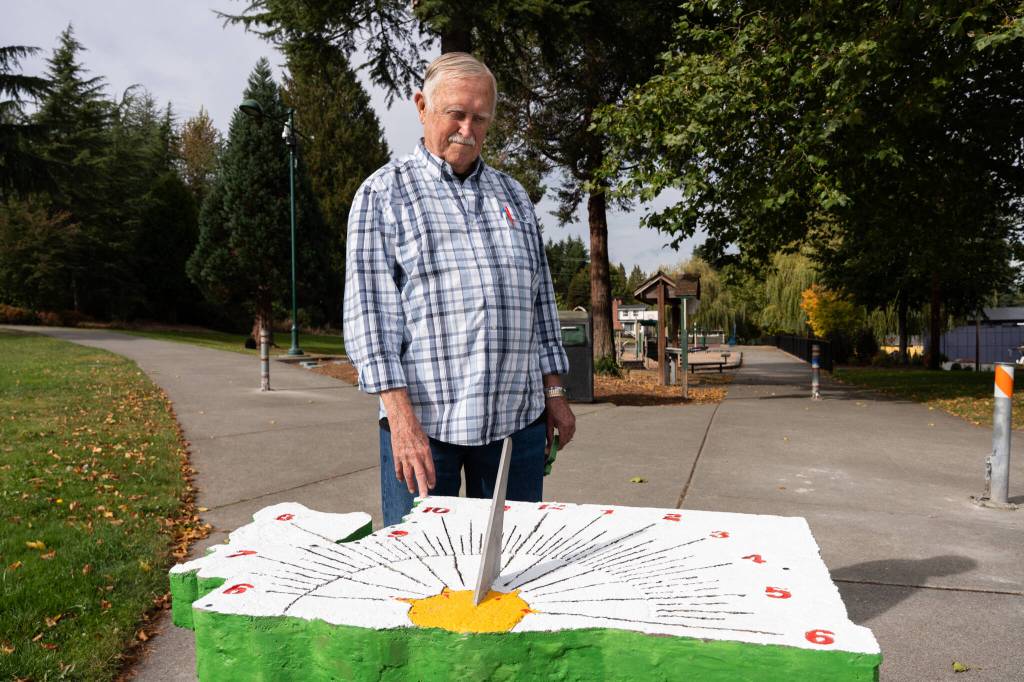 photos by Will Geschke / The Herald 
James Stegenga stands with his sundial on Sept. 30 in Lions Park in south Everett.