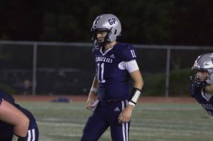 Glacier Peak quarterback Oliver Setterberg prepares for the snap during a non-league game against Snohomish on Friday, Sept. 12, 2025 at Veterans Memorial Stadium in Snohomish, Wash. (Qasim Ali / The Herald)