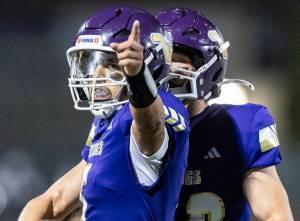 Lake Stevens’ Blake Moser points after getting enough yards for a first down during the game against Sumner on Friday, Sept. 5, 2025 in Lake Stevens, Washington. (Olivia Vanni / The Herald)