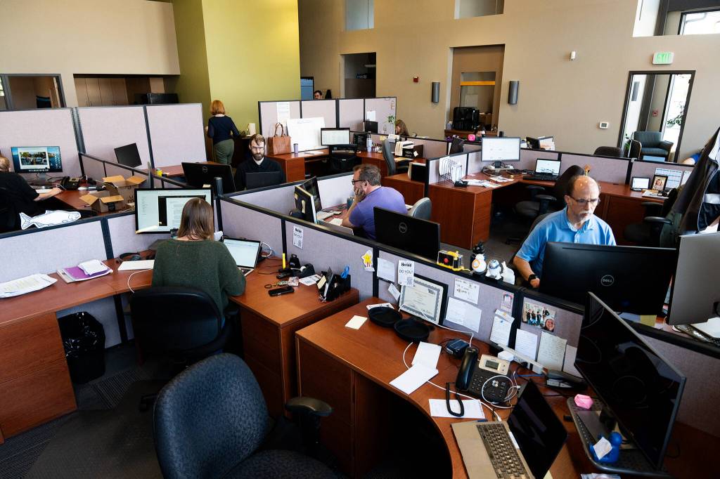 Photos by Will Geschke / The Herald
Staff at The Daily Herald work on Wednesday in the companys new offices located on Hewitt Avenue in Everett.