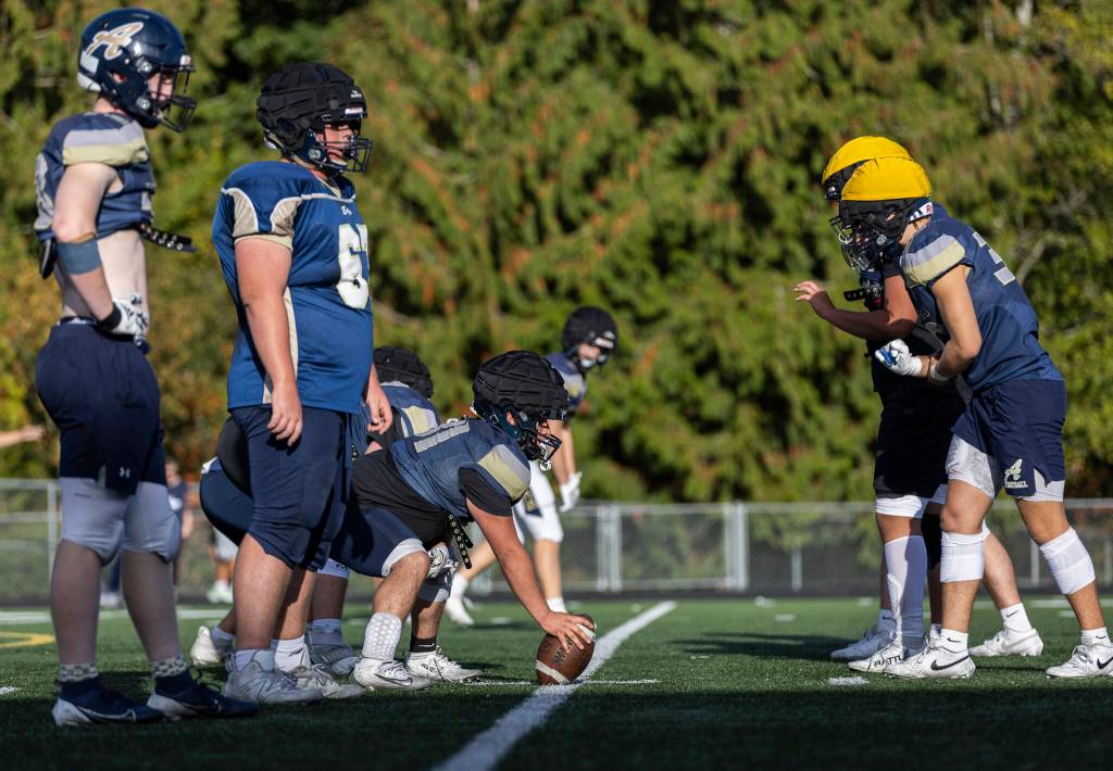 Arlingtons offensive line and defensive line face off during practice on Oct. 8, 2025 in Arlington, Washington. (Olivia Vanni / The Herald)
